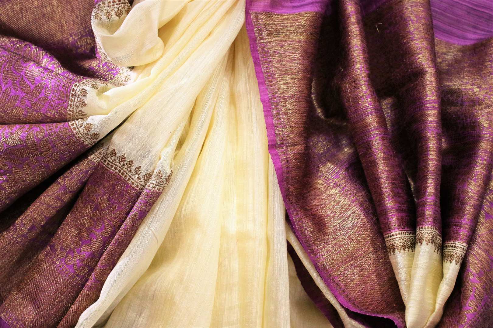 Buy cream Banarasi tussar saree online in USA with purple border. Browse through a range of traditional Indian saris in USA at Pure Elegance online store. Shop now.-details