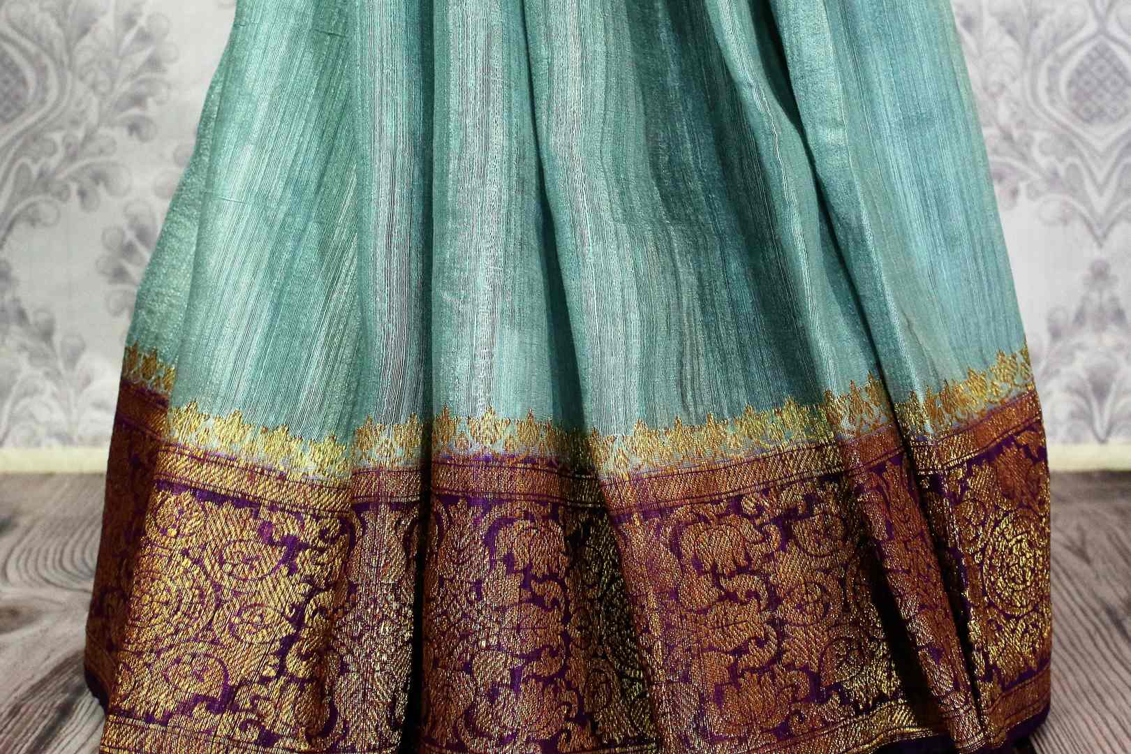 Buy sky blue Benarasi tussar saree online in USA with purple border. Browse through a range of traditional Indian saris in USA at Pure Elegance online store. Shop now.-pleats
