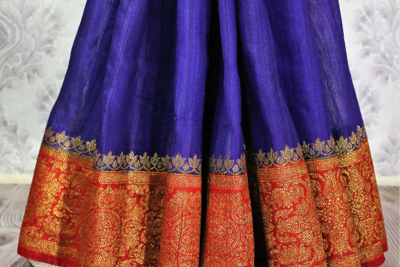 Buy blue Benarasi tussar saree online in USA with red border. Browse through a range of traditional Indian sarees for weddings at Pure Elegance online store. Shop now.-pleats