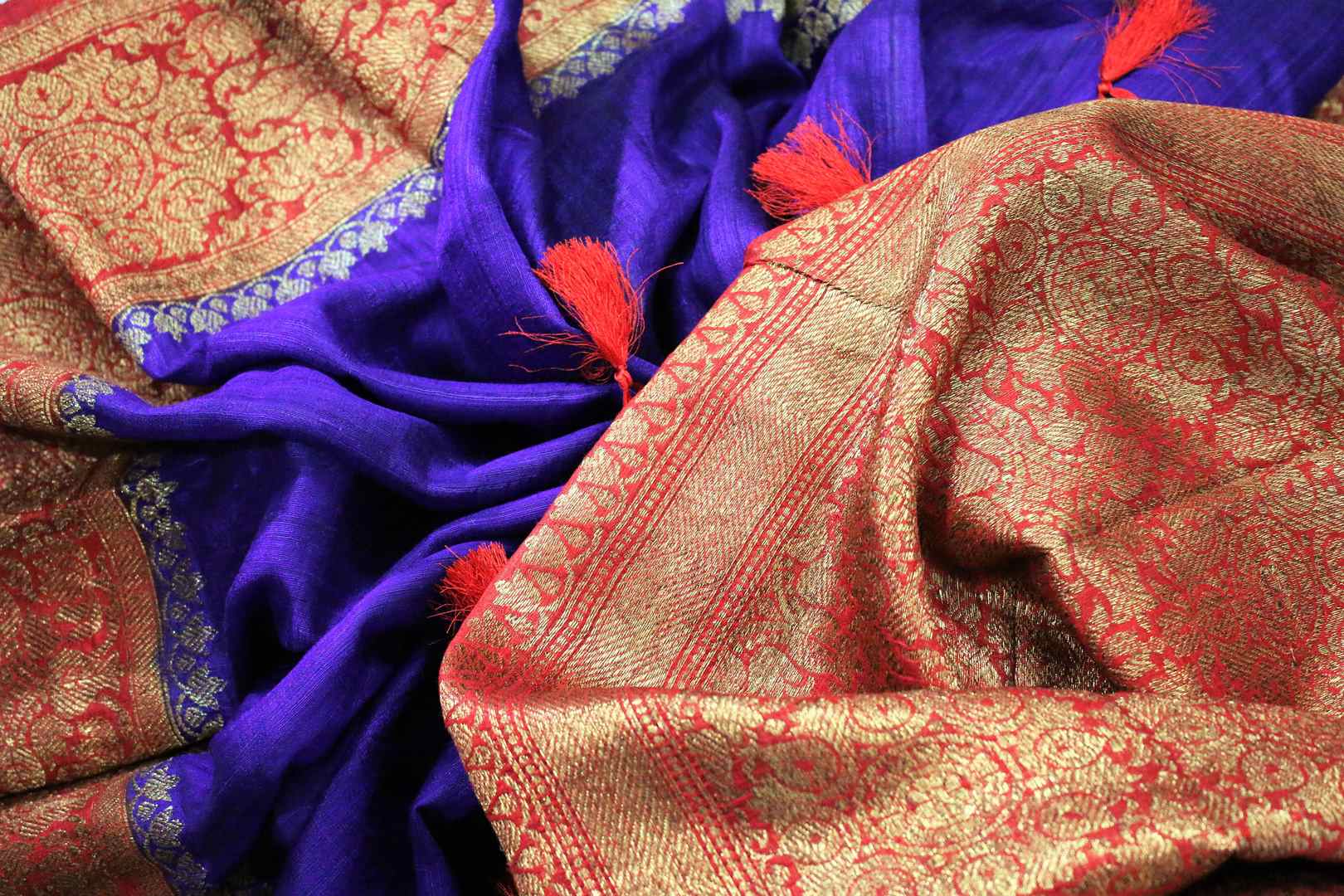 Buy blue Benarasi tussar saree online in USA with red border. Browse through a range of traditional Indian sarees for weddings at Pure Elegance online store. Shop now.-details