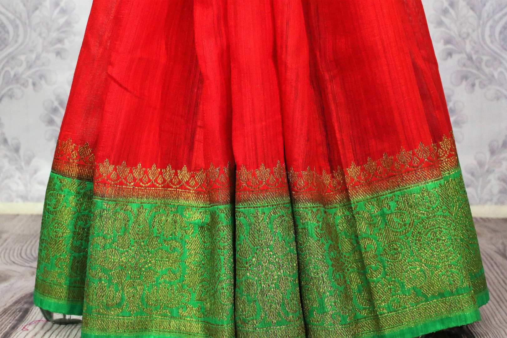 Buy red Banarasi tussar saree online in USA with green border. Browse through a range of traditional Indian sarees for weddings at Pure Elegance online store. Shop now.-pleats