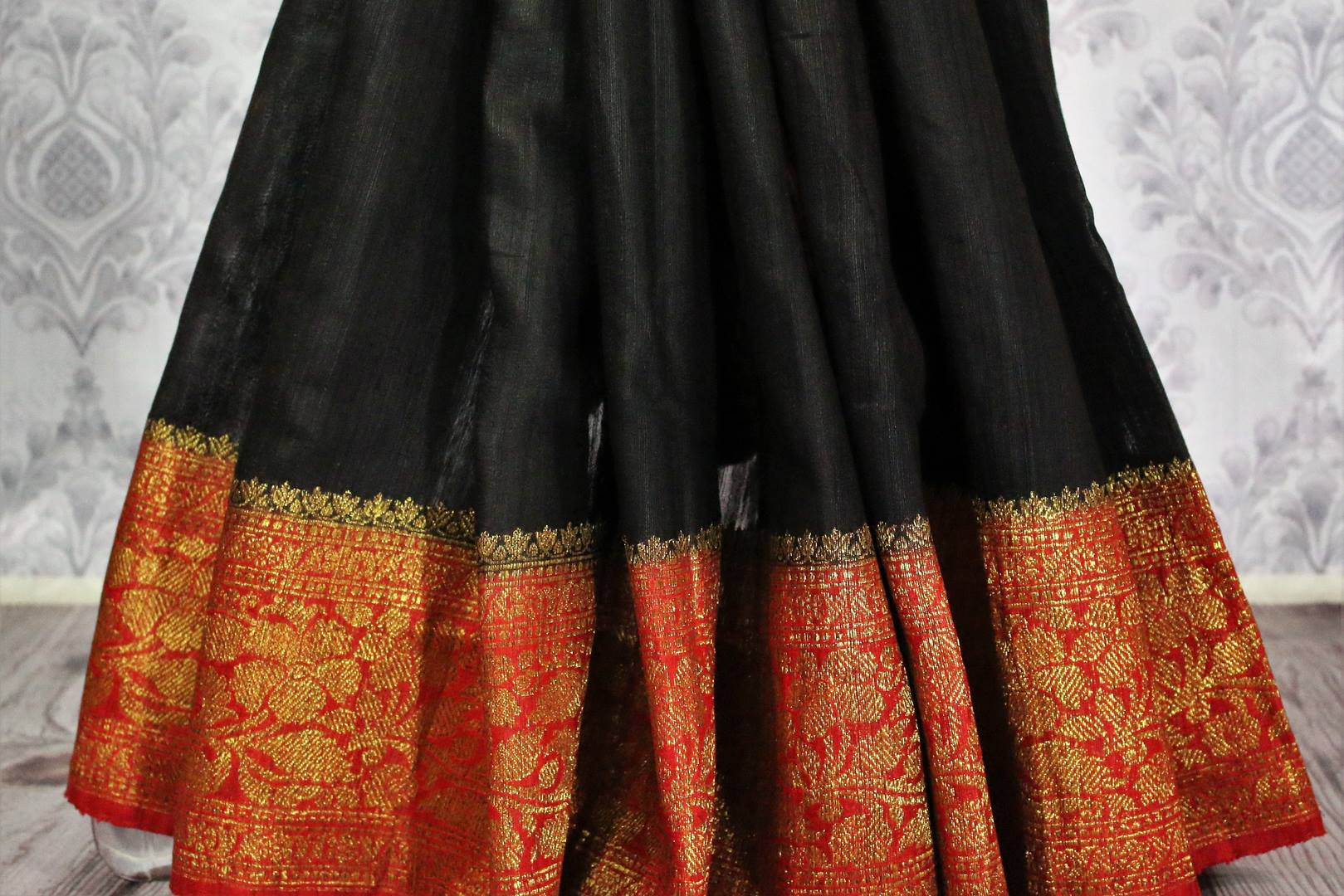 Shop black tussar Banarasi saree online in USA with red border. Explore a range of Indian wedding saris in USA at Pure Elegance online or visit our store in USA.-pleats