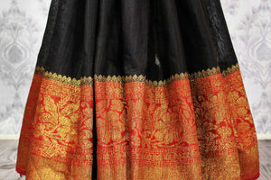 Shop black tussar Banarasi sari online in USA with red border. Explore a range of Indian desinger wedding sarees in USA at Pure Elegance online store. Shop now.-pleats