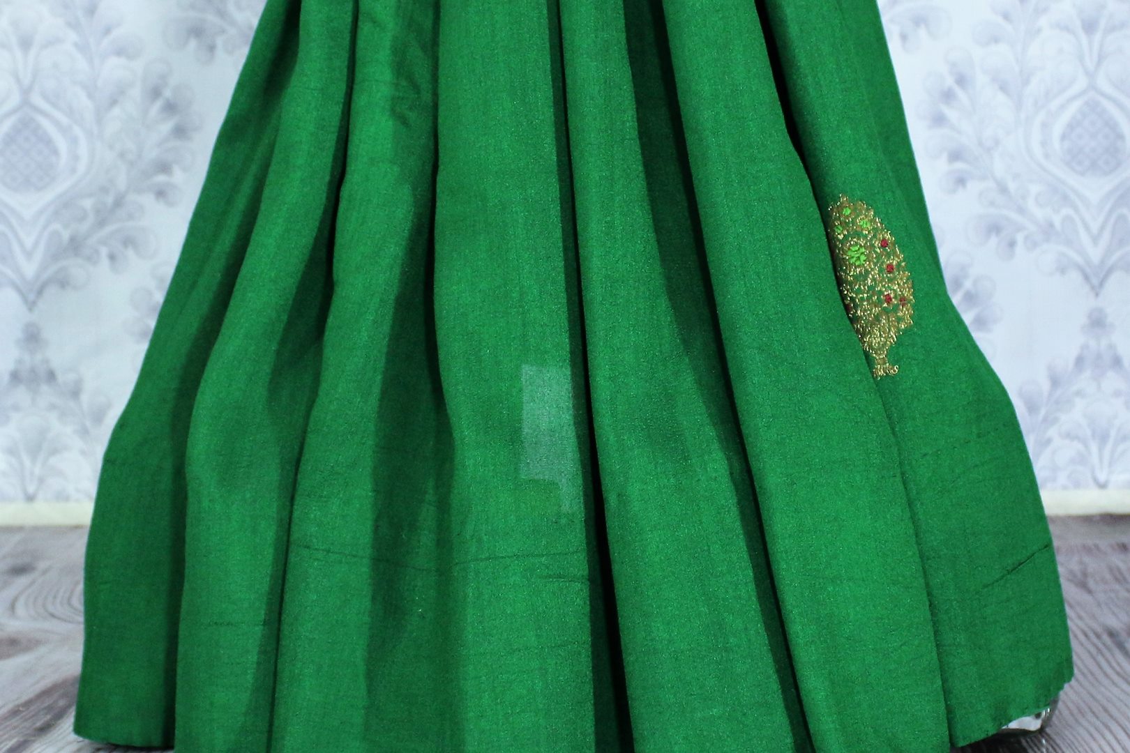 Elegant green muga Banarasi sari with buta buy online in USA. Shop the latest design Indian designer sarees from Pure Elegance clothing store in USA for women.-pleats