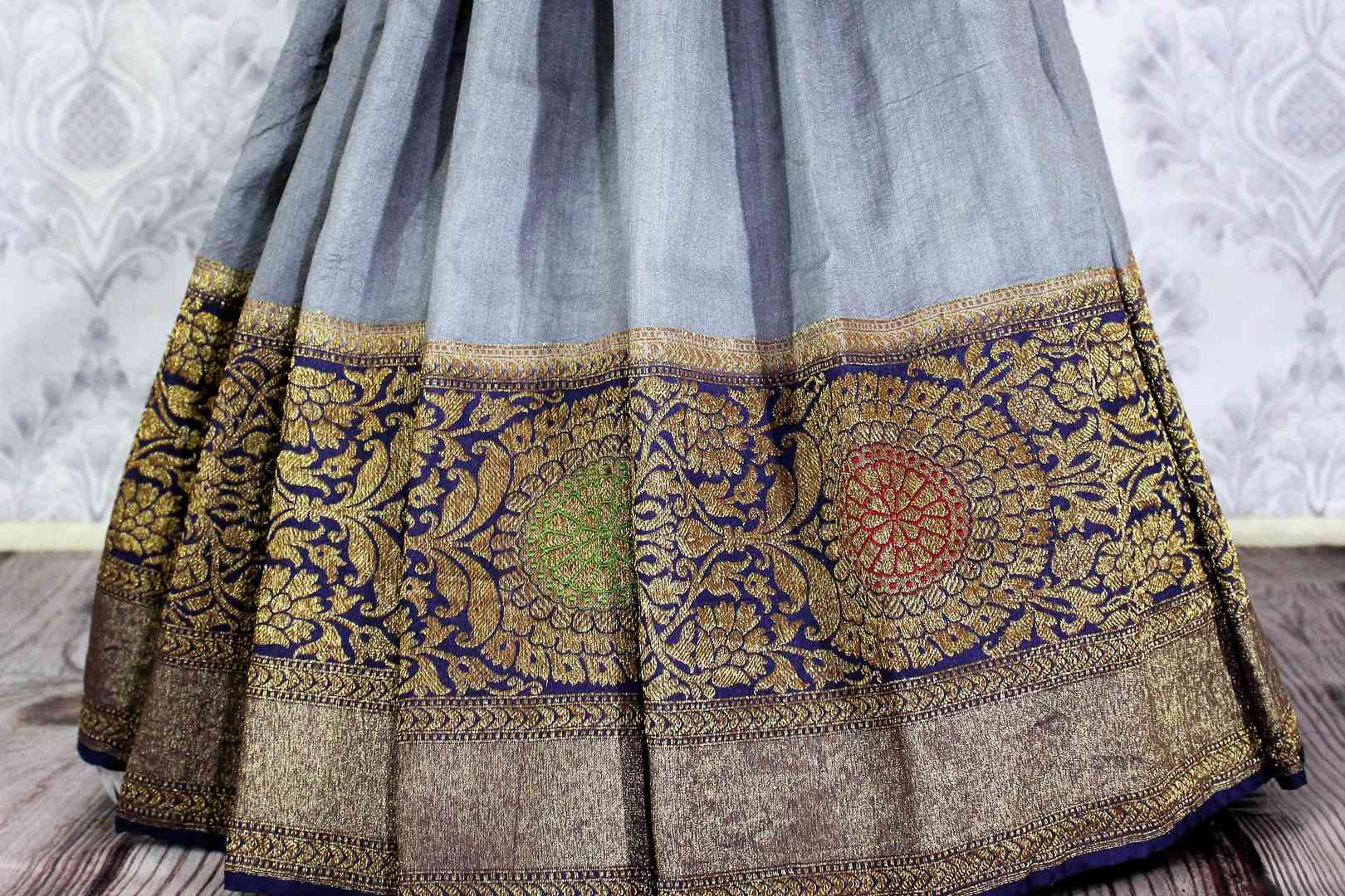 Grey Muga Benarasi saree with meenakari zari border buy online in USA. Explore a range of exclusive Banarasi sarees in USA at Pure Elegance Indian clothing store.-pleats
