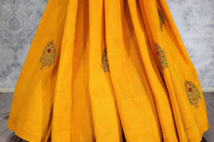 Bright yellow muga Banarasi saree with buta buy online in USA. Shop the latest design Indian designer sarees from Pure Elegance clothing store in USA for women.-pleats