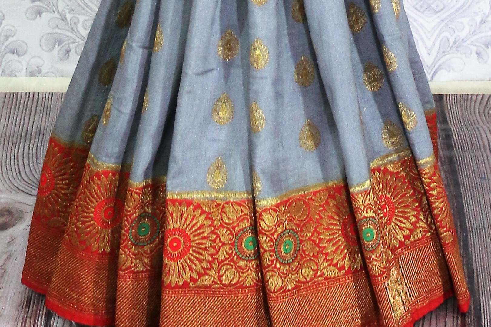 Grey Muga Banarasi saree with golden buta buy online in USA. Explore a range of traditional Banarasi sarees in USA at Pure Elegance Indian clothing store for women.-pleats