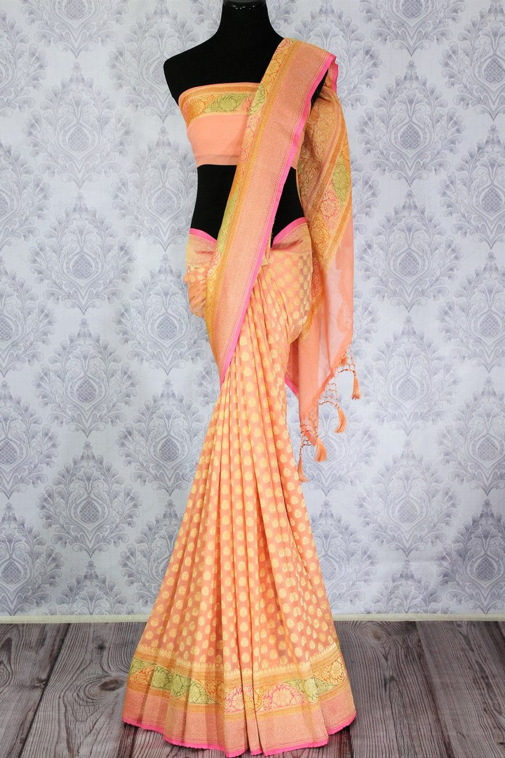 Beautiful peach color georgette Banarasi saree with zari buta buy online in USA. Explore a range of Indian designer sarees at Pure Elegance clothing store for women.-full view