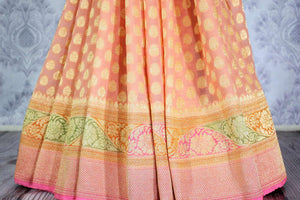 Beautiful peach color georgette Banarasi saree with zari buta buy online in USA. Explore a range of Indian designer sarees at Pure Elegance clothing store for women.-pleats