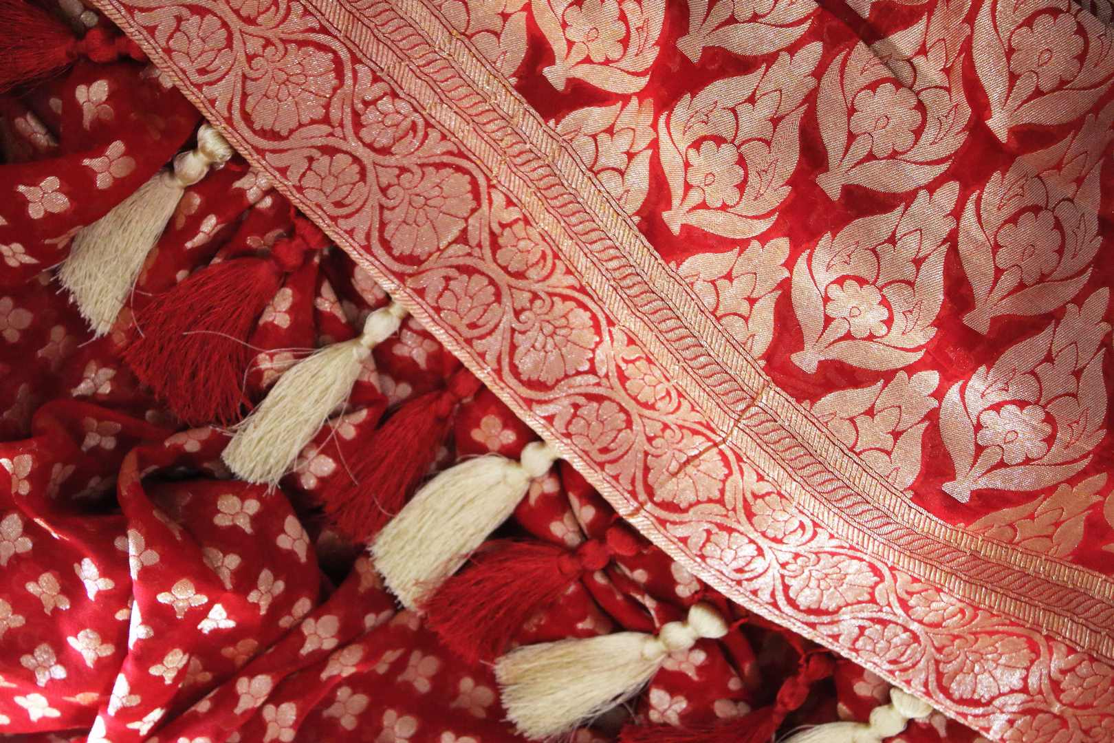 Buy bright red georgette Banarasi saree online in USA. The alluring design of the saree with overall zari work and buta makes it perfect for a traditional wedding look. Select from an exquisite collection of traditional Indian Banarasi sarees, designer saris at Pure Elegance clothing store or shop online.-details