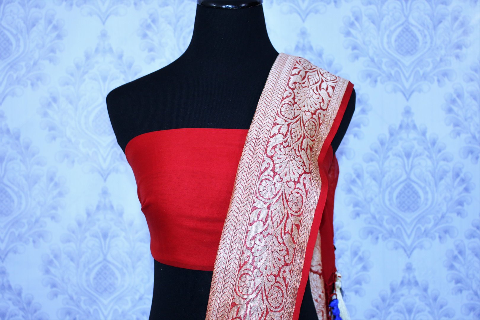 Buy blue georgette Banarasi saree online in USA. The alluring design of the saree with red zari border and buta makes it perfect for parties and festivals. Select from an exquisite collection of traditional Indian Banarasi sarees, designer saris at Pure Elegance clothing store or shop online.-blouse pallu
