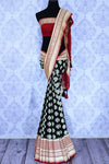 Buy beautiful black georgette Banarasi sari online in USA. The alluring design of the saree with red zari border and buta makes it perfect for parties and festivals. Select from an exquisite collection of traditional Indian Banarasi sarees, designer sarees at Pure Elegance clothing store or shop online for weddings.-full view