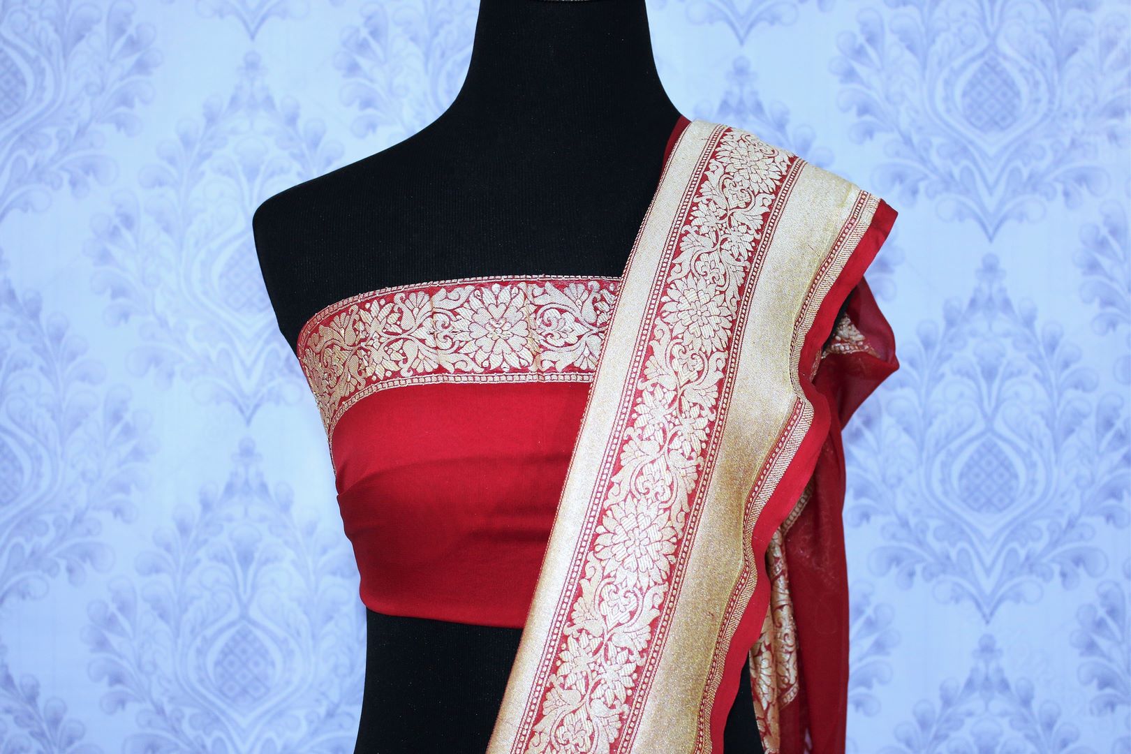 Buy beautiful black georgette Banarasi sari online in USA. The alluring design of the saree with red zari border and buta makes it perfect for parties and festivals. Select from an exquisite collection of traditional Indian Banarasi sarees, designer sarees at Pure Elegance clothing store or shop online for weddings.-blouse pallu