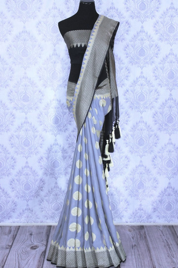 Grey georgette Banarasi sari with silver buta for online shopping in USA. The traditional saree is contrasted with a black zari border which makes it so captivating. Select from an exquisite collection of traditional Indian Banarasi saris, designer sarees at Pure Elegance clothing store or shop online.-full view