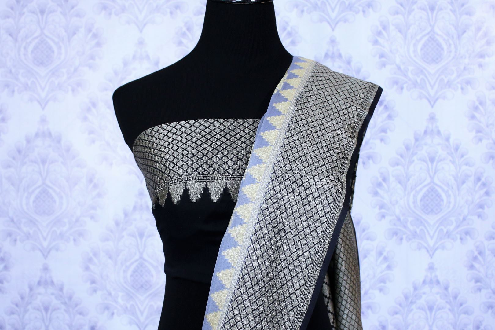 Grey georgette Banarasi sari with silver buta for online shopping in USA. The traditional saree is contrasted with a black zari border which makes it so captivating. Select from an exquisite collection of traditional Indian Banarasi saris, designer sarees at Pure Elegance clothing store or shop online.-blouse pallu