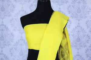 Buy lemon yellow muga Banarasi sari online in USA. The bright saree is a great choice for a classic Indian saree look at special occasions. Select from an exquisite collection of traditional Indian Banarasi sarees, silk sarees at Pure Elegance clothing store or shop online for weddings, parties, and festivals.-blouse pallu