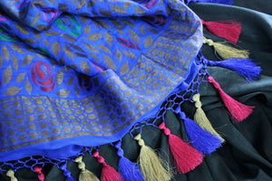 Buy black muga Banarasi sari online in USA with blue pallu. The beautiful saree is a great choice for a classic Indian saree look at special occasions. Select from an exquisite collection of traditional Indian Banarasi sarees, silk saris at Pure Elegance clothing store or shop online for weddings, parties, and festivals.-details
