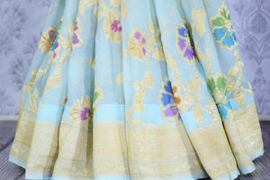 Buy sky blue georgette Banarasi saree online in USA. The alluring design of the saree with  golden pallu and border makes it perfect for a traditional look. Select from an exquisite collection of traditional Indian Banarasi sarees, designer saris at Pure Elegance clothing store or shop online.-pleats