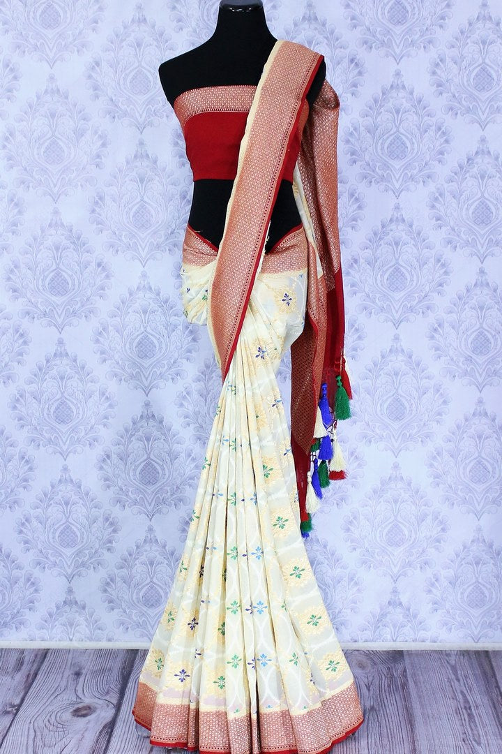 Buy cream georgette Banarasi saree online in USA. The alluring design of the saree with red zari border and minakari makes it perfect for a traditional festival look. Select from an exquisite collection of traditional Indian Banarasi sarees, designer saris at Pure Elegance clothing store or shop online.-full view