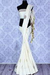 Buy classic off-white muga Banarasi sari online in USA with buta. The striking saree is a great choice to keep it simple and ethnic at special occasions. Select from an exquisite collection of traditional Indian Banarasi saris at Pure Elegance clothing store or shop online for occasions like weddings, parties, and festivals.-full view