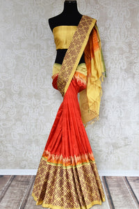 Buy traditional red silk sari online in USA with ikat border. The elegant saree is perfect for a rich Indian ethnic look at festivals and special occasions. Choose your favorite saree from an exclusive collection of Indian silk sarees available at Pure Elegance clothing store in USA.-full view