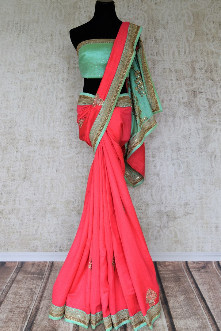 Indulge in fresh breeze and put a spring in your step as you drape this pink tussar georgette silk designer sari. Style the saree with a contrasting turquoise embroidered blouse and the heavily woven pallu. Shop designer silk saris, Indian dress, lehenga cholis, printed sarees online or visit Pure Elegance store, USA.-full view