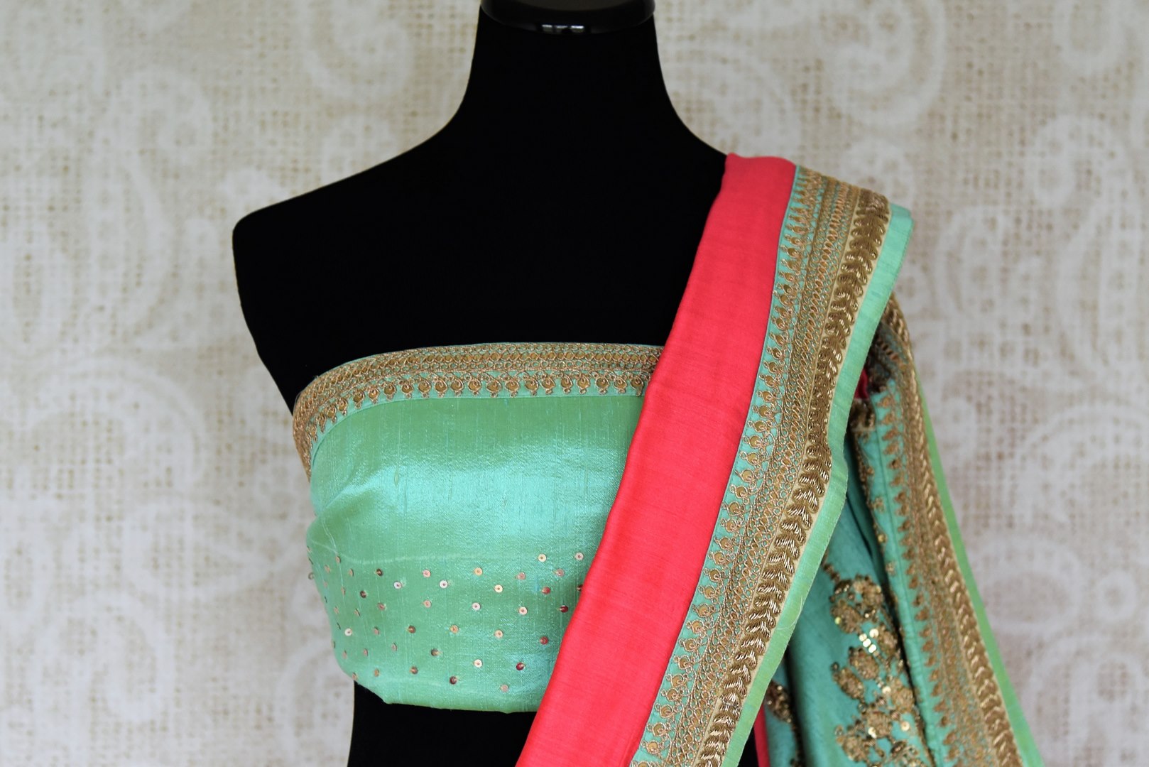 Indulge in fresh breeze and put a spring in your step as you drape this pink tussar georgette silk designer sari. Style the saree with a contrasting turquoise embroidered blouse and the heavily woven pallu. Shop designer silk saris, Indian dress, lehenga cholis, printed sarees online or visit Pure Elegance store, USA.-blouse pallu