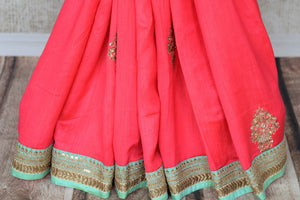 Indulge in fresh breeze and put a spring in your step as you drape this pink tussar georgette silk designer sari. Style the saree with a contrasting turquoise embroidered blouse and the heavily woven pallu. Shop designer silk saris, Indian dress, lehenga cholis, printed sarees online or visit Pure Elegance store, USA.-pleats