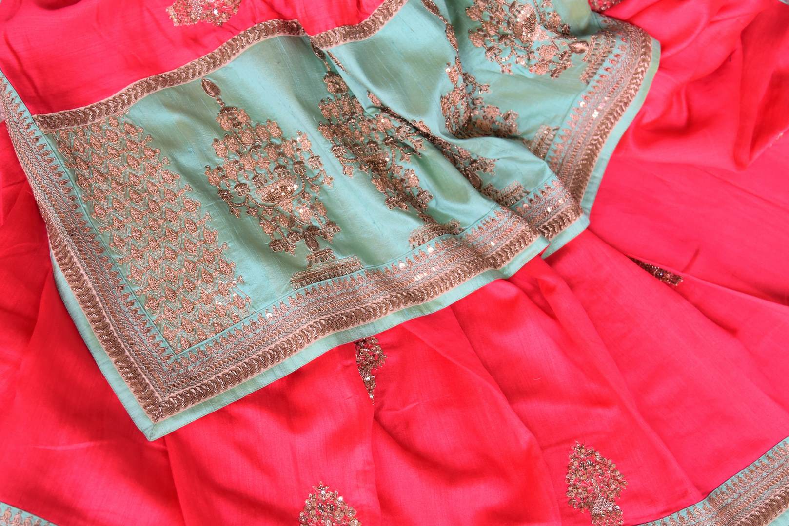 Indulge in fresh breeze and put a spring in your step as you drape this pink tussar georgette silk designer sari. Style the saree with a contrasting turquoise embroidered blouse and the heavily woven pallu. Shop designer silk saris, Indian dress, lehenga cholis, printed sarees online or visit Pure Elegance store, USA.-details