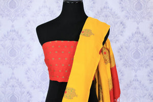 This yellow muga banarsi silk saree is totally stealing our heart away. The vibrant hued embroidered silk sari is perfect for festivities and weddings. Style this gorgeous sari with contrasting bright red designer blouse. Shop designer silk sarees, printed sarees, ikkat sari online or visit Pure Elegance store in USA.-blouse pallu