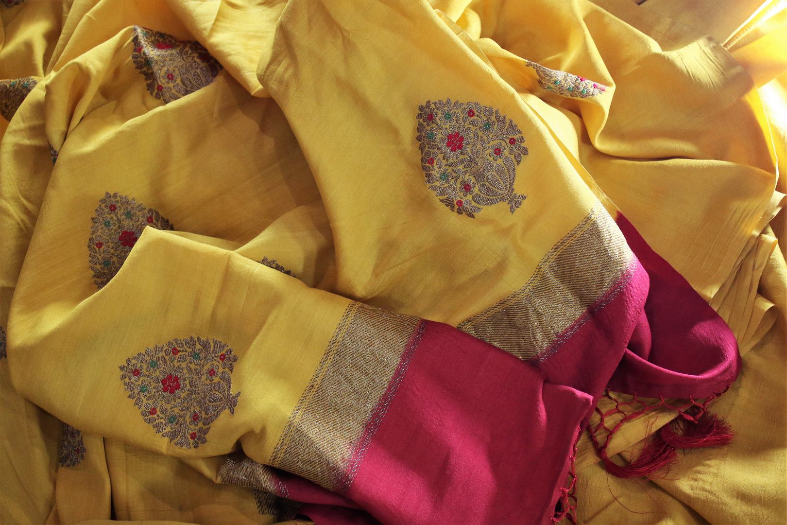 This yellow muga banarsi silk saree is totally stealing our heart away. The vibrant hued embroidered silk sari is perfect for festivities and weddings. Style this gorgeous sari with contrasting bright red designer blouse. Shop designer silk sarees, printed sarees, ikkat sari online or visit Pure Elegance store in USA.-details