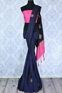 Dress up for weddings and special events in this royal blue designer muga banarsi silk sari with a stunning zari work. Style this glorious saree with a contrasting pink blouse complemented with a pink border on the heavily embroidered pallu to turn heads. Shop designer sarees online or visit Pure Elegance store in USA.-full view