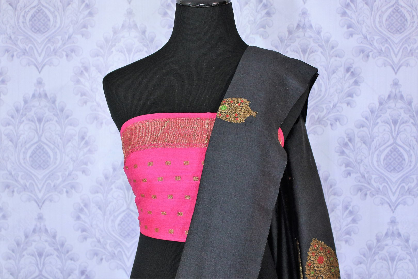 Slay effortlessly in this designer black muga banarsi silk designer sari with a gorgeous blend of zari embroidery. Style this astonishing saree with a contrasting pink zari silk blouse complemented with a rich embroidered pallu. Shop designer silk sarees online or visit Pure Elegance store in USA.-blouse pallu