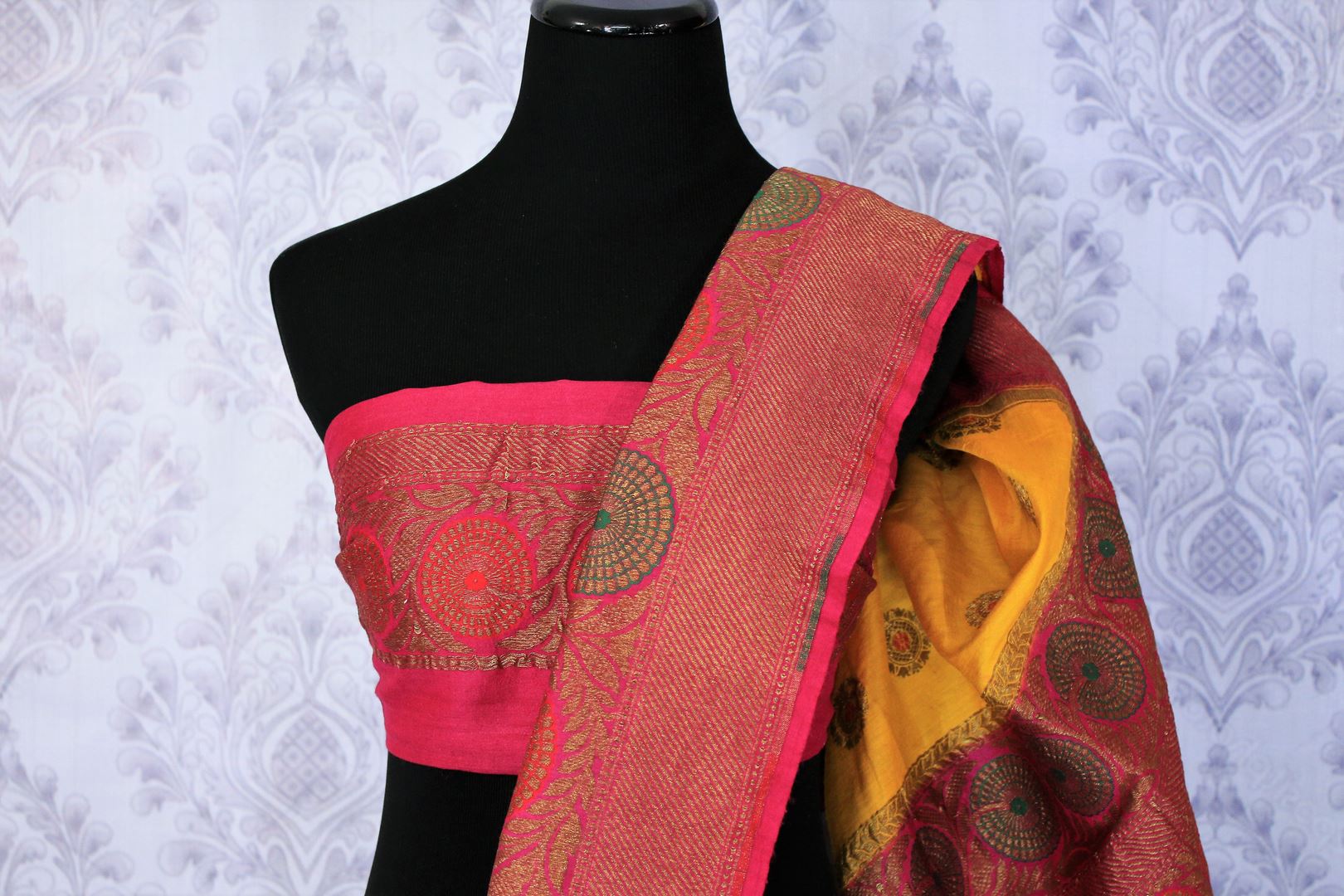 Your perfect wedding ensemble in traditional yellow and red combination with zari detailing is oh so dreamy. Indulge in this breath-taking muga banarsi silk saree complemented with a heavy woven red pallu and designer red blouse. Shop designer silk sarees, ikkat sarees online or visit Pure Elegance store in USA.-blouse pallu 