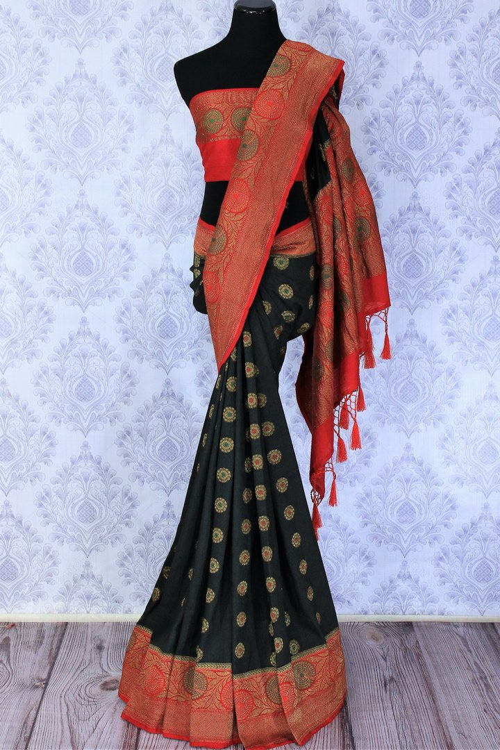 A classic black and red silk saree with buta work and zari border is totally in vogue. Style this designer muga banarsi silk saree with a red embroidered blouse and get ready to be poured with compliments galore. Shop designer silk sarees, kalamkari sarees, Indian dress online or visit Pure Elegance store in USA.-full view