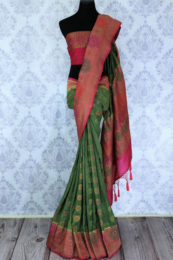 This astonishingly beautiful green embroidered muga banarsi silk saree looks effortlessly charming for weddings and events. Style this designer half-half silk sari with a red zari embroidered blouse. Shop designer silk sarees, printed saris, ikkat sarees online or visit Pure Elegance store in USA. -full view