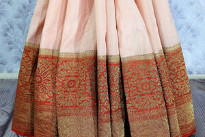 Don the beautiful peach zari embroidery silk saree with the red silk designer blouse. Elevate your style game with this floral embroidered silk sari complemented with a deep red rich pallu to feel the authenticity. Shop such designer silk sarees printed saris, cikkat saris online or visit Pure Elegance store in USA. -pleats