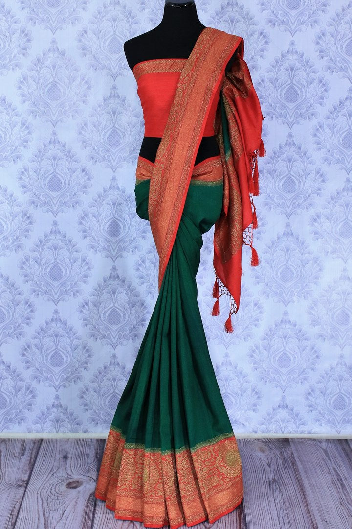The ever-graceful green with red zari embroidered muga banarsi silk saree is a women's must-have. The traditional colors flowing together with the gorgeous blend of zari artwork. Take this stunner to parties, gala events and weddings. Shop this designer sari, printed sarees online or visit Pure Elegance store in USA.-full view