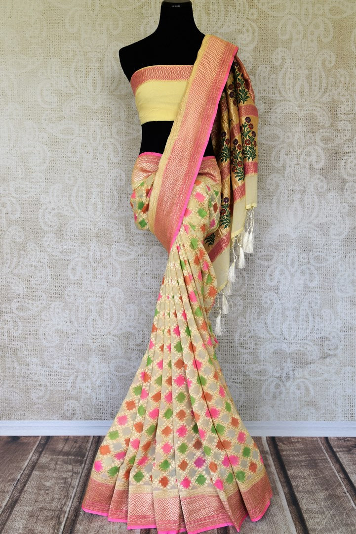 Embrace elegance in this yellow georgette banarsi silk sari. It comes with a handwoven design on the sari with beautiful zari work on border. The pallu features rich heavily floral work embroidered with precision. Shop such handcrafted silk sarees, linen sari, chiffon saree online or visit Pure Elegance store, USA. -full view