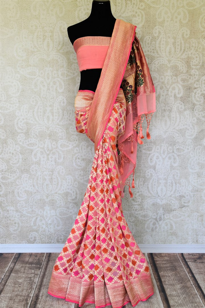 Exude feminity in this pink georgette banarsi silk saree. Perfect for summer-time weddings and parties, this sari comes with a stylish pink blouse. The sari has a zari border and handwoven motifs all over with a rich embroidered pallu. Shop such handcrafted silk sarees online or visit Pure Elegance store, USA. -full view