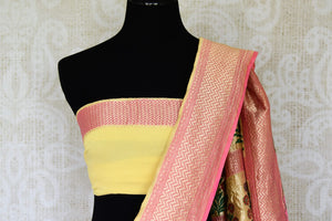 Look alluring in this gorgeous yellow georgette banarsi silk saree. It comes with a royal zari border and handwoven motifs all over the sari. Style it with a yellow zari detailed blouse. Shop printed sarees, embroidery sari online or visit Pure Elegance store, USA.-blouse pallu