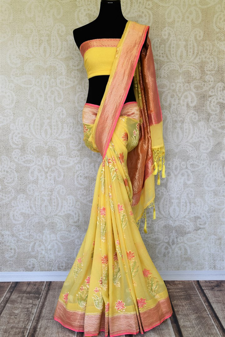 Flaunt your summertime style in this peppy yellow georgette banarsi silk saree with a zari border. Style it with a stunning yellow zari blouse. The gorgeous detailing is drool-worthy and you can shop such designer silk saris, linen sarees, ikkat saris online or visit Pure Elegance store, USA.-full view