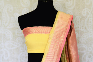 Flaunt your summertime style in this peppy yellow georgette banarsi silk saree with a zari border. Style it with a stunning yellow zari blouse. The gorgeous detailing is drool-worthy and you can shop such designer silk saris, linen sarees, ikkat saris online or visit Pure Elegance store, USA.-blouse pallu