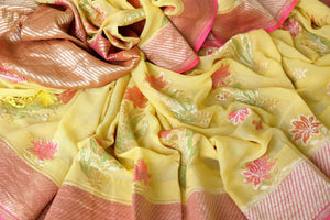 Flaunt your summertime style in this peppy yellow georgette banarsi silk saree with a zari border. Style it with a stunning yellow zari blouse. The gorgeous detailing is drool-worthy and you can shop such designer silk saris, linen sarees, ikkat saris online or visit Pure Elegance store, USA.-details