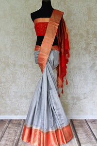 Buy graceful grey tussar Banarasi saree online in USA with red zari border and buta. Make an elegant ethnic fashion statement at parties, weddings and special occasions with a splendid collection of Indian designer sarees, Banarasi saris, handwoven saris from Pure Elegance Indian clothing store in USA or shop online.-full view