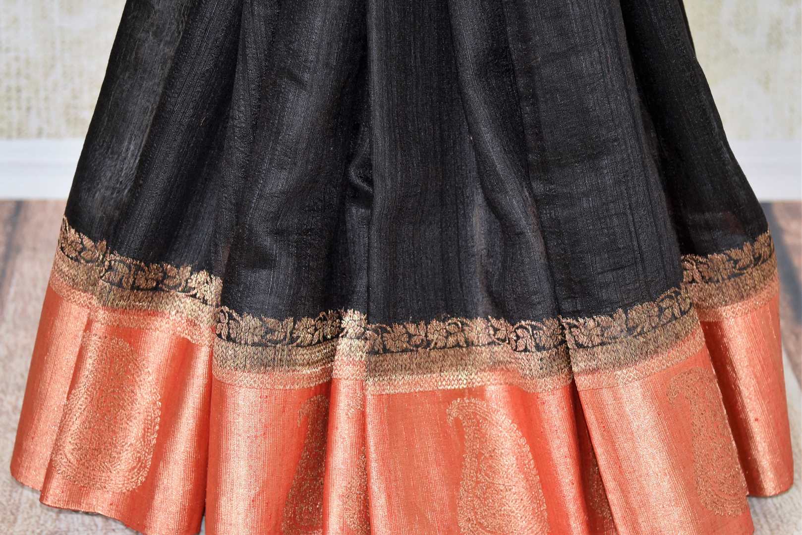 Buy black tussar Benarasi sari online in USA with red zari border and pallu. Make an elegant ethnic fashion statement at parties, weddings and special occasions with a splendid collection of Indian designer sarees, Banarasi saris, handloom saris from Pure Elegance Indian clothing store in USA or shop online.-pleats