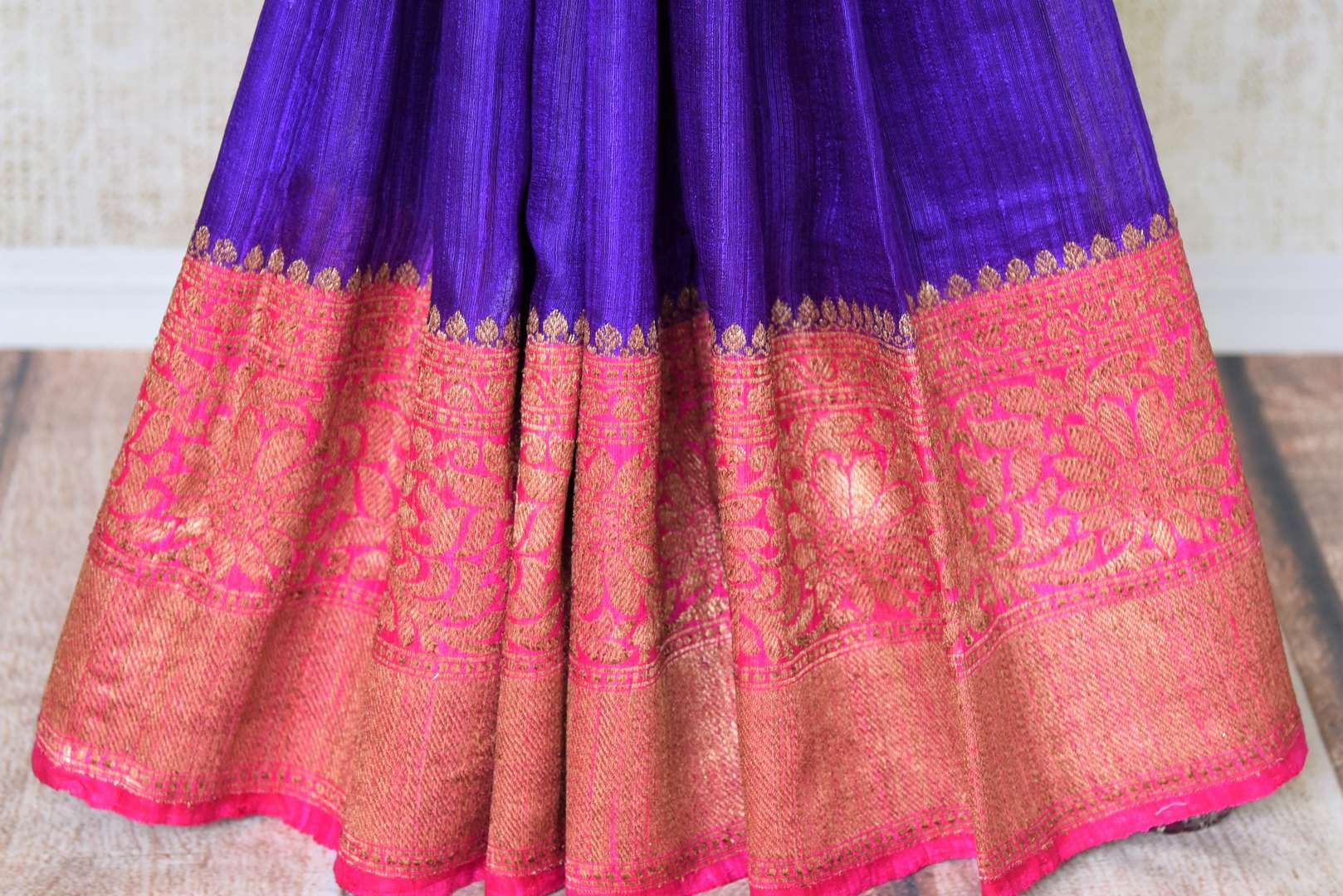 Grace the special occasion like festivity or wedding in our stunning blue matka banarsi silk sari. It comes with a gorgeous pink zari border and a contrasting pink zari woven blouse to complement the ensemble. Shop handcrafted silk sari, linen saree, chiffon sari online or visit Pure Elegance store, USA.-pleats