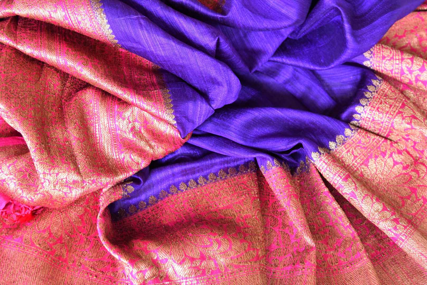 Grace the special occasion like festivity or wedding in our stunning blue matka banarsi silk sari. It comes with a gorgeous pink zari border and a contrasting pink zari woven blouse to complement the ensemble. Shop handcrafted silk sari, linen saree, chiffon sari online or visit Pure Elegance store, USA.-details