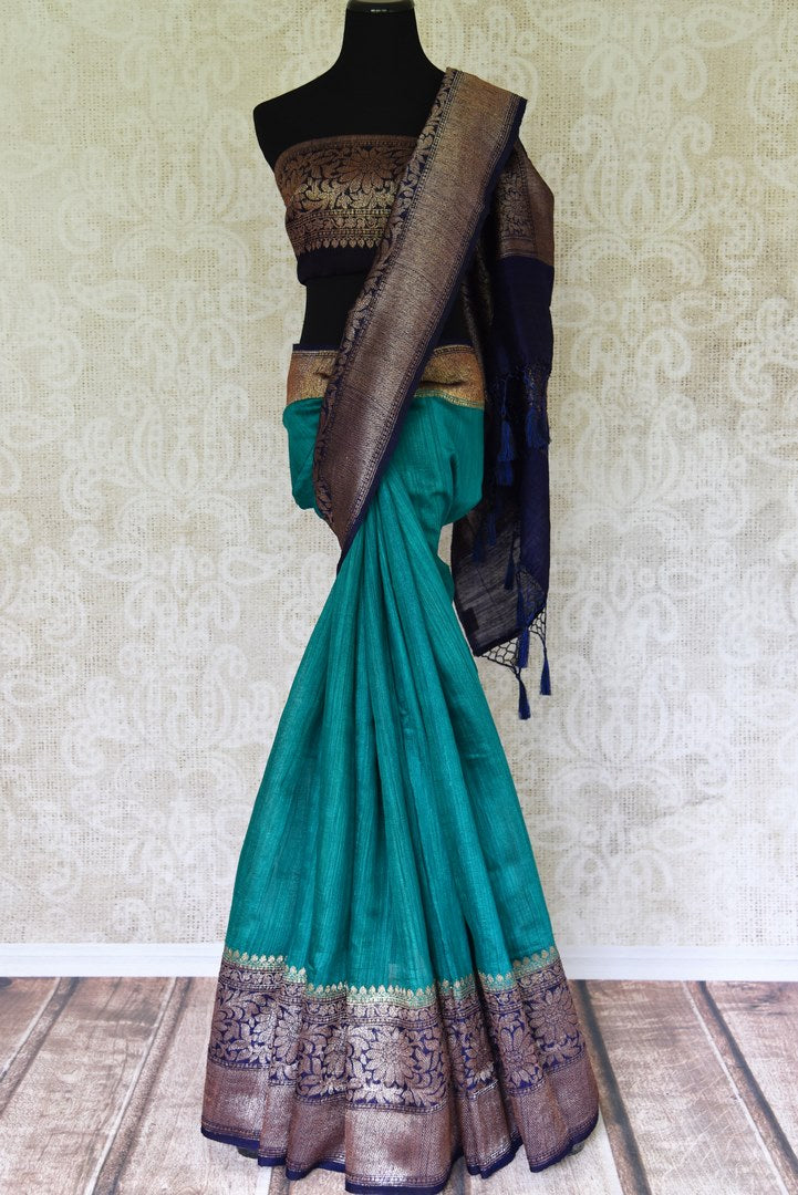 Accentuate your beauty with this exclusively designed mint green matka banarsi silk saree. It comes with a gorgeous zari handwoven border and a contrasting royal blue zari blouse. Complement the sari with pearl jewelry. Shop designer banarsi silk sari, organza saree, linen sari online or visit Pure Elegance store, USA.-full view