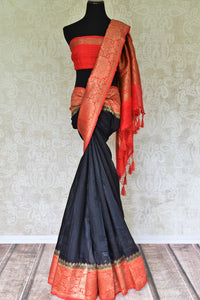 Enhance the subtle charm with classic black matka banarsi silk saree which comes with a vibrant red zari border. Strut to social events in this ensemble. Style it with a gorgeous red zari blouse to turn heads. Shop handloom sarees, kanjeevaram silk sari, linen sari online or visit Pure Elegance store, USA. -full view